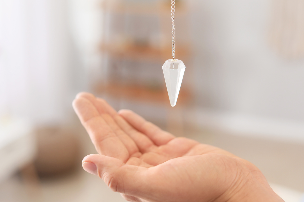 Reiki Master with Biolocation Pendulum